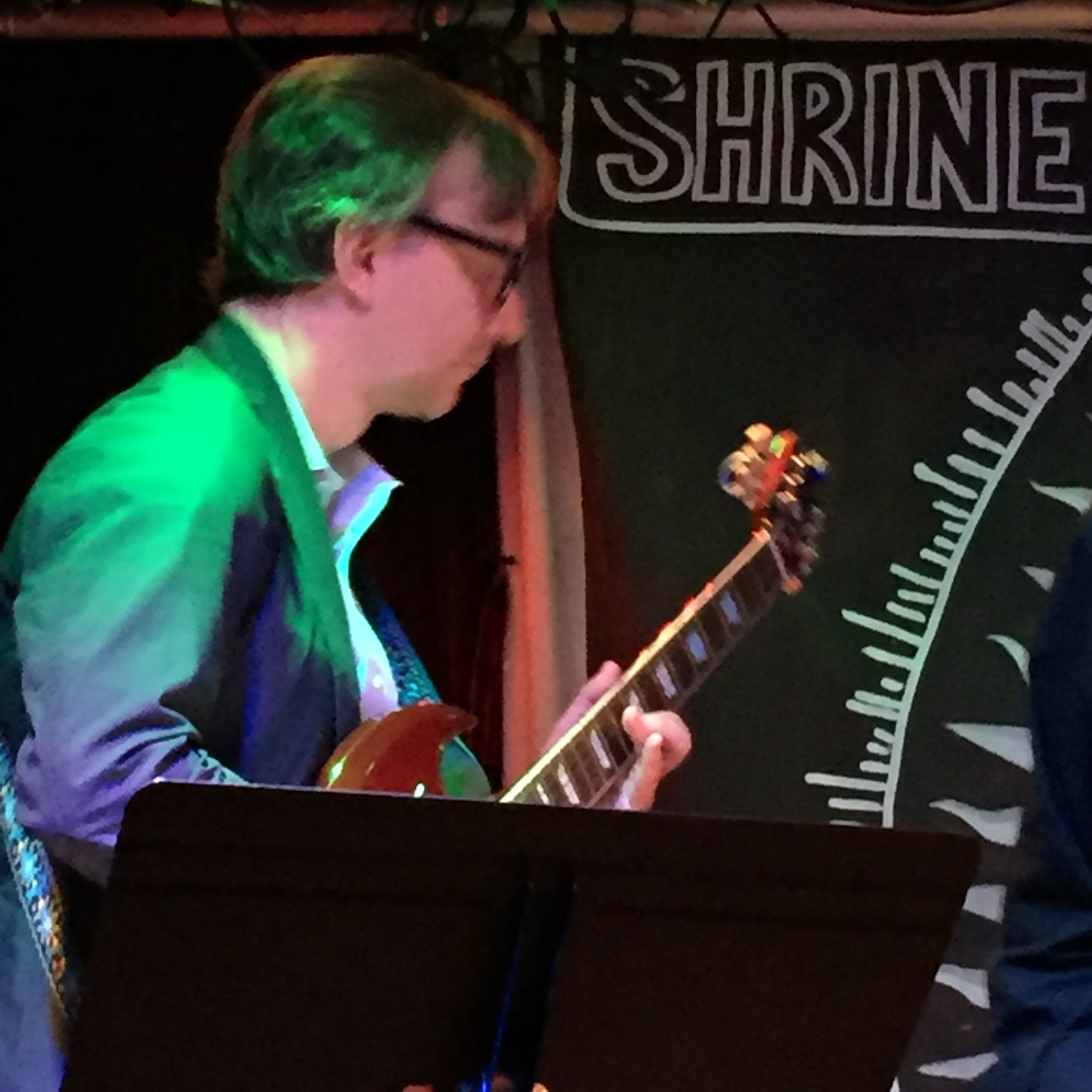 Chester Jankowski playing jazz guitar at Shrine Jazz Club in New York City.